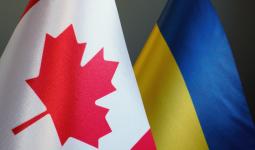 Flags of Canada and Ukraine as symbol of cooperation.